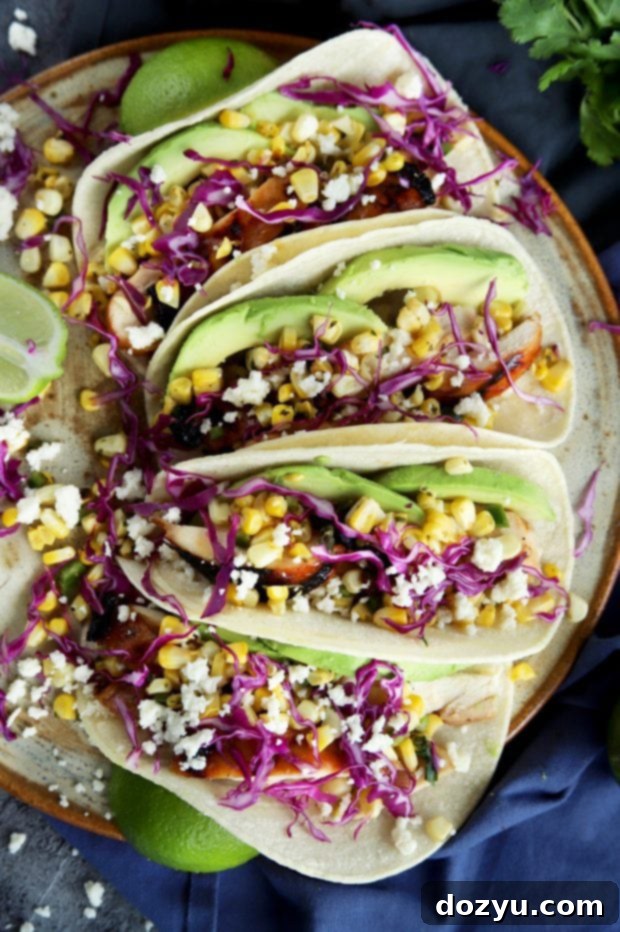 Charred Corn Chicken Avocado Tacos with fresh toppings