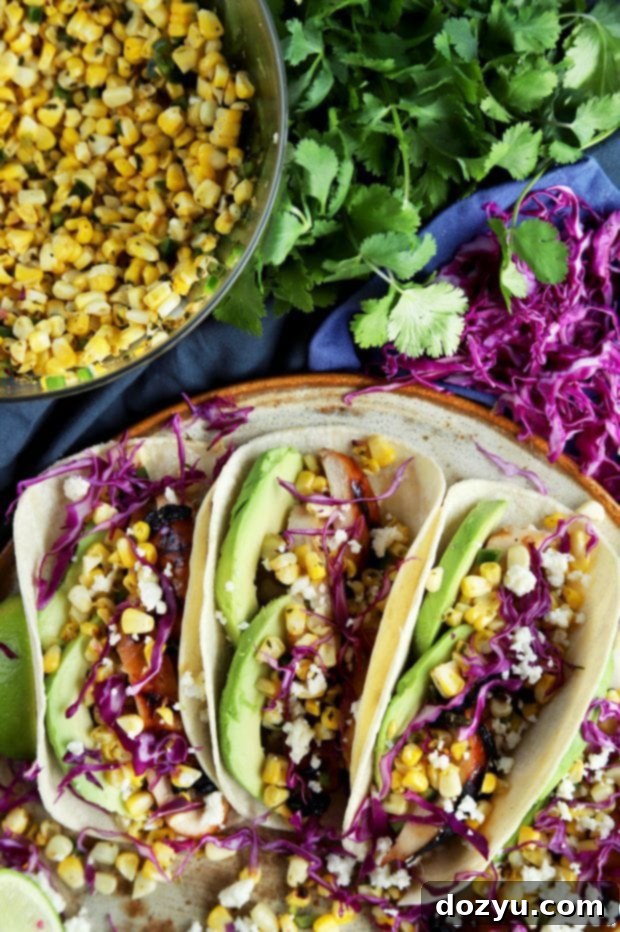Charred Corn Chicken Avocado Tacos on a serving platter