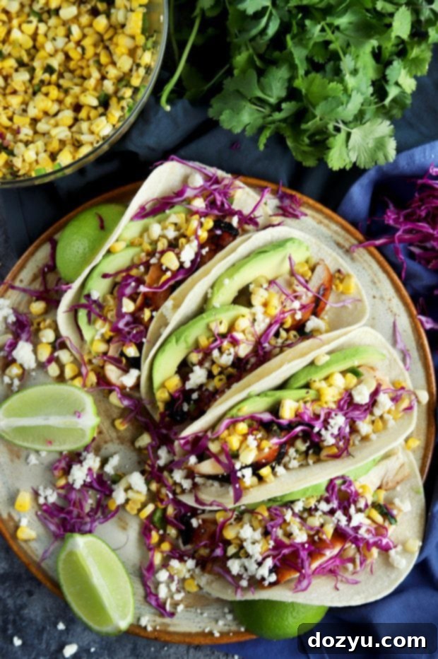 Charred Corn Chicken Avocado Tacos with various toppings