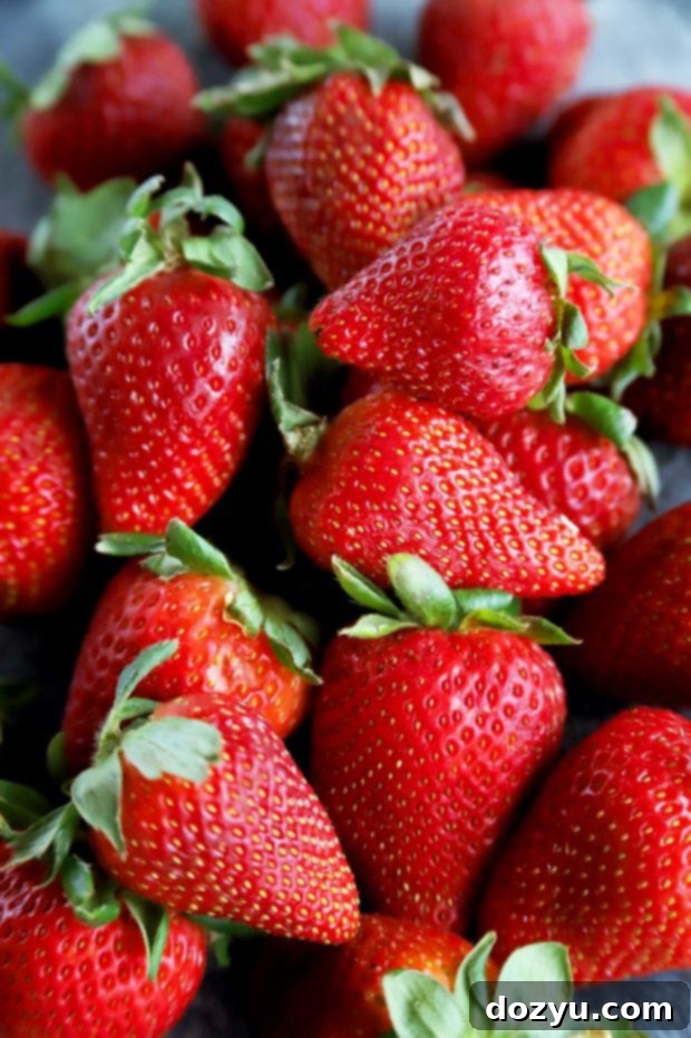 A vibrant display of fresh organic strawberries from Sprouts Farmers Market, showcasing their quality