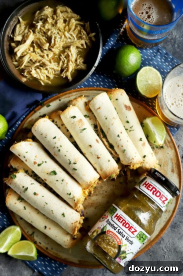 HERDEZ roasted salsa verde with a platter of delicious chicken taquitos ready to serve