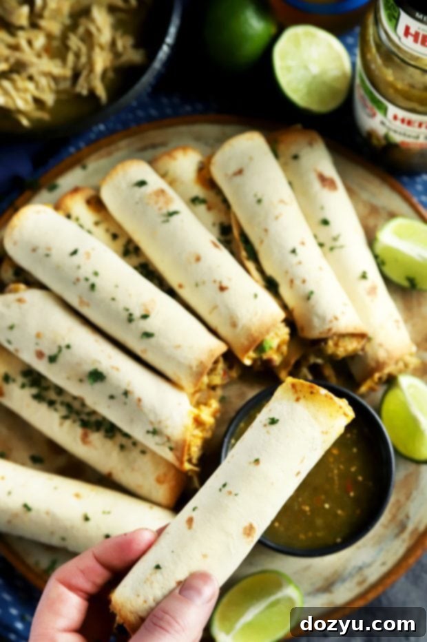 An easy and delicious Mexican party appetizer: Creamy Salsa Verde Chicken Baked Taquitos with HERDEZ