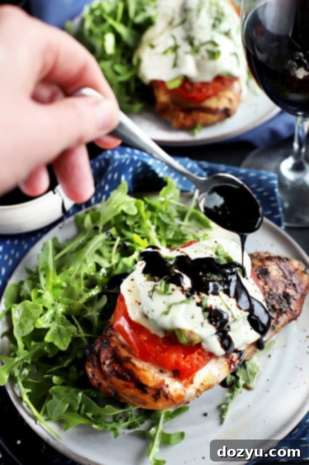 Drizzling balsamic reduction on grilled chicken