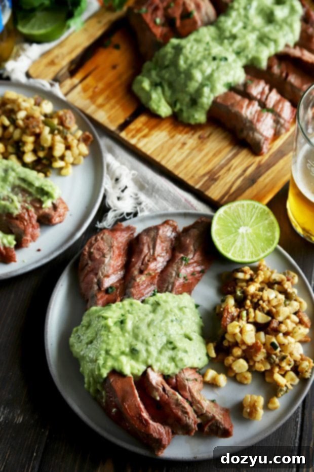 Grilled Chipotle Lime Flank Steak with Creamy Avocado Salsa served with corn salad