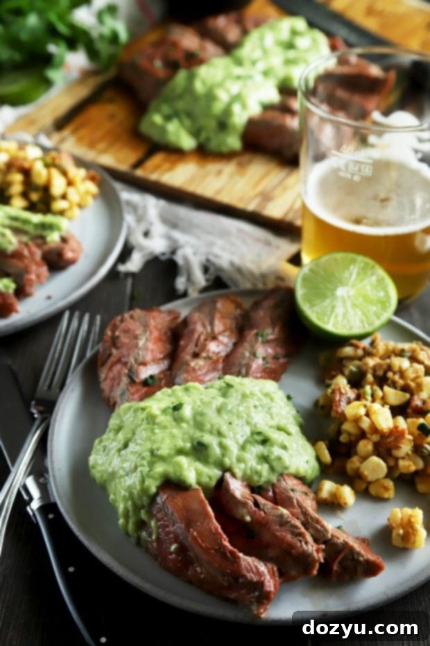 Sliced chipotle lime flank steak with beers and corn salad
