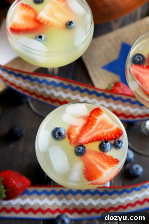 Patriotic Brunch Punch 5 Brunch punch served in elegant coupe glasses, garnished with fresh berries
