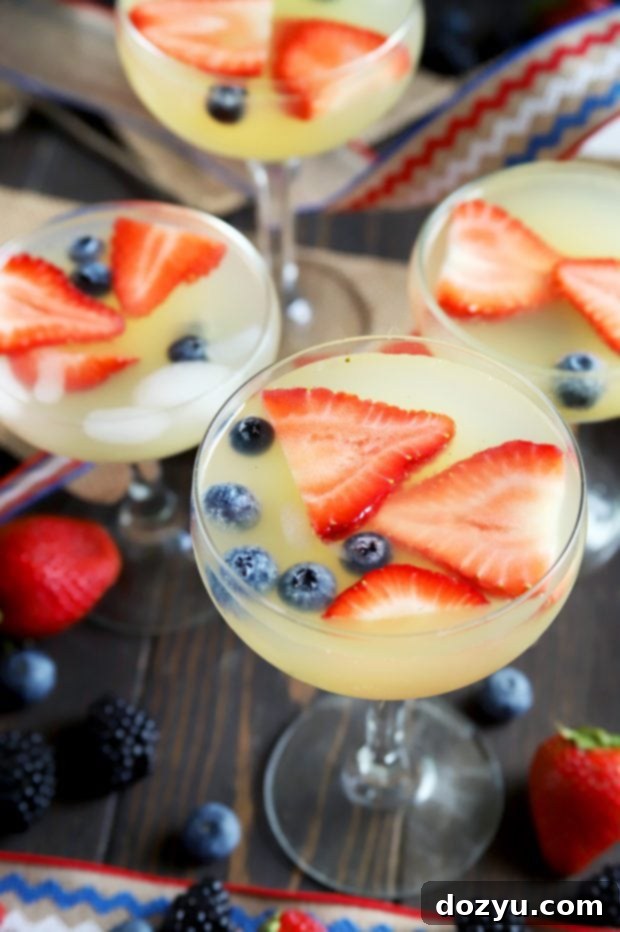 Patriotic Brunch Punch 6 July 4th cocktails featuring red, white, and blue fresh fruit