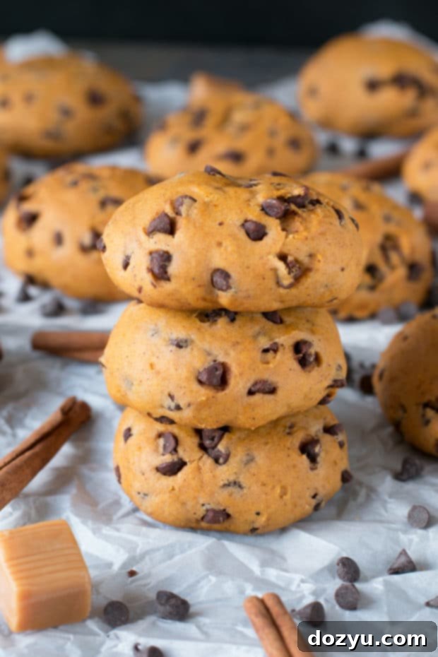 Gooey Caramel Pumpkin Cookies 6 A plate of freshly baked caramel stuffed pumpkin cookies