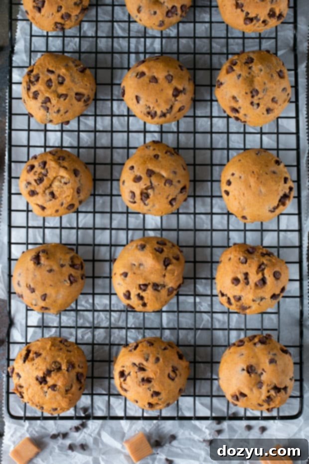 Gooey Caramel Pumpkin Cookies 7 Caramel stuffed pumpkin cookies baking on a silicone mat