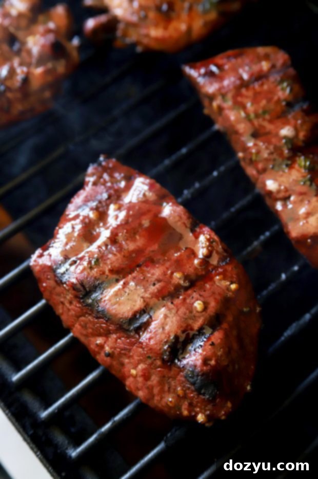 Grilling steak on the grill