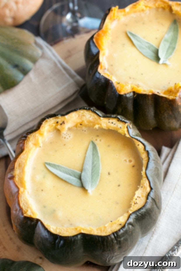 Individual bowls of rich ginger acorn squash soup, a perfect warming dish for the colder months.