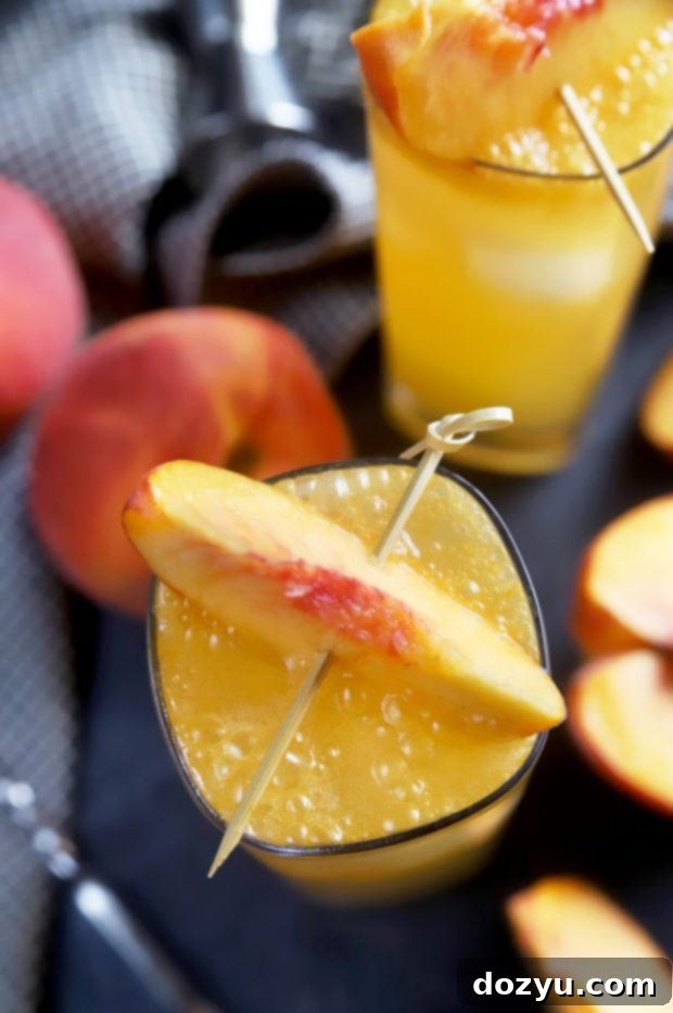 Highball cocktails garnished with fresh peach slices
