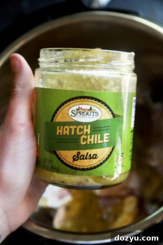Hatch Green Chile Chicken Nacho Bites 6 A jar of Sprouts Hatch Green Chile Salsa, showcasing the fresh, vibrant green color
