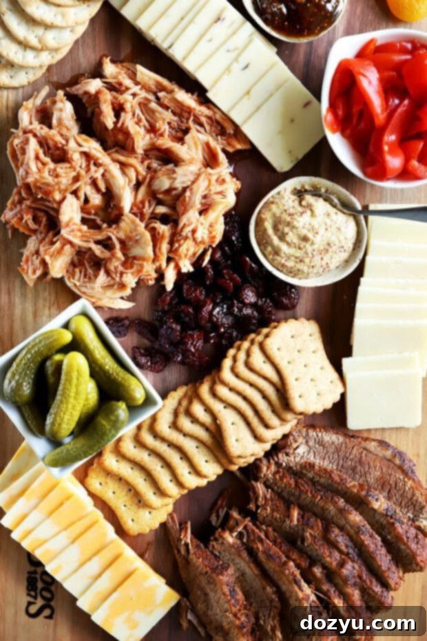 Cheese, crackers and BBQ meats arranged artfully on a charcuterie board.