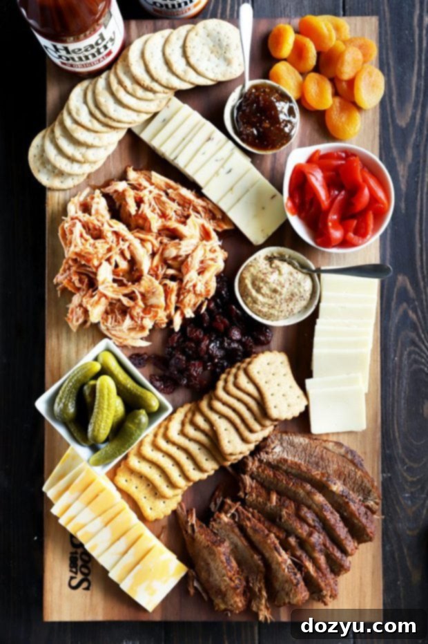 A fully assembled charcuterie board featuring various BBQ meats, cheeses, crackers, and condiments.