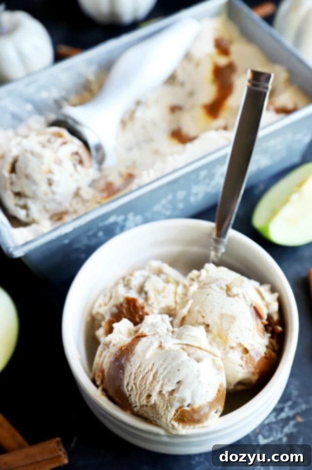 Spiced Caramel Apple Dream 3 A bowl of freshly scooped caramel apple ice cream with a spoon