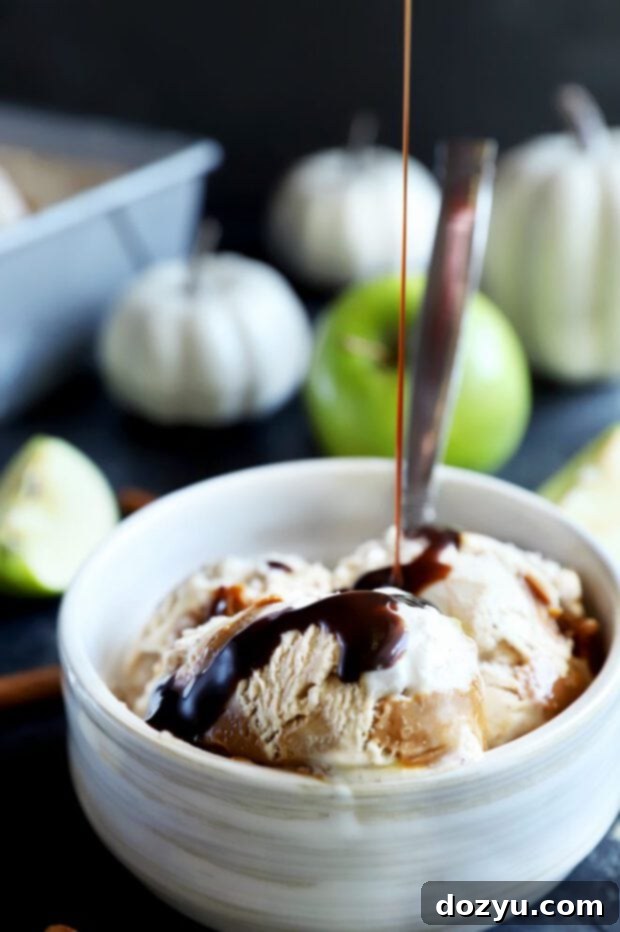 Spiced Caramel Apple Dream 8 Pouring chocolate sauce over a scoop of caramel apple ice cream in a bowl