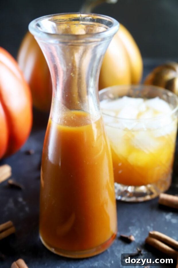 A display of pumpkin flavored syrup and cocktails, highlighting its versatility in drinks.