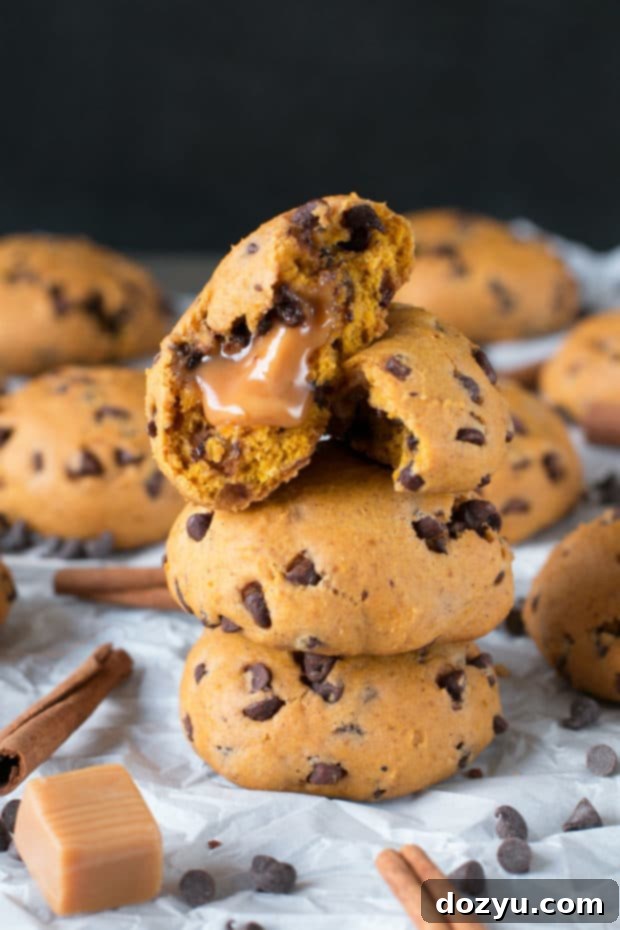 Caramel Stuffed Pumpkin Chocolate Chip Cookies, a decadent fall treat.