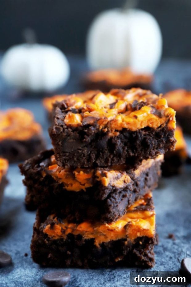 Wicked Halloween Cheesecake Brownies 2 Halloween dessert stacked up, black and orange