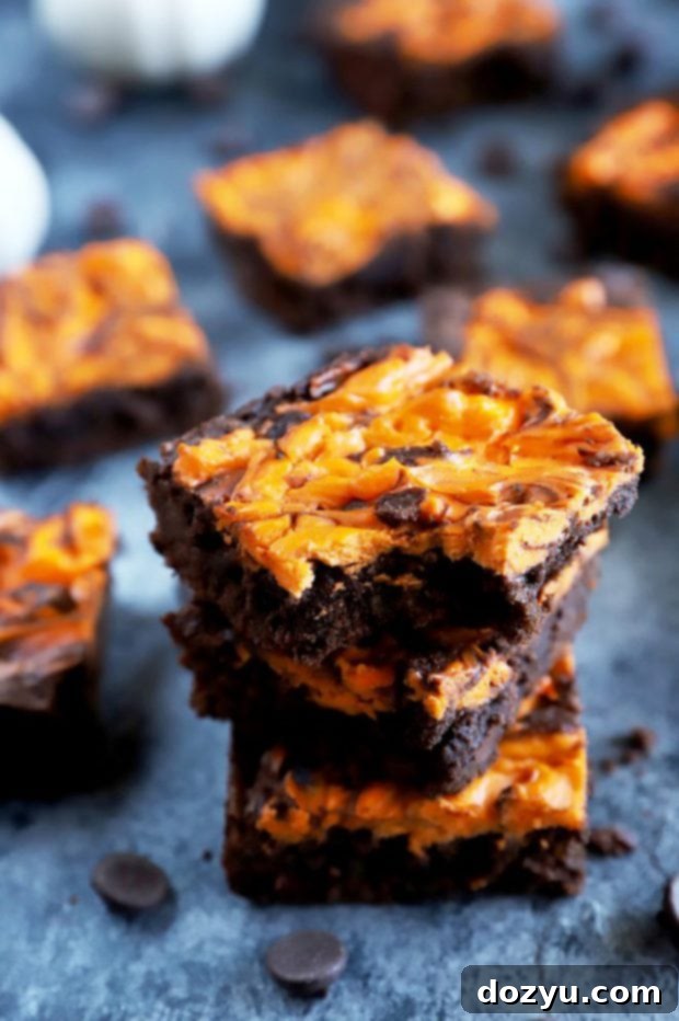 Wicked Halloween Cheesecake Brownies 5 Bite taken out of a brownie for Halloween