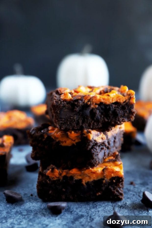 Wicked Halloween Cheesecake Brownies 6 Cheesecake brownies stacked up and photo from the side