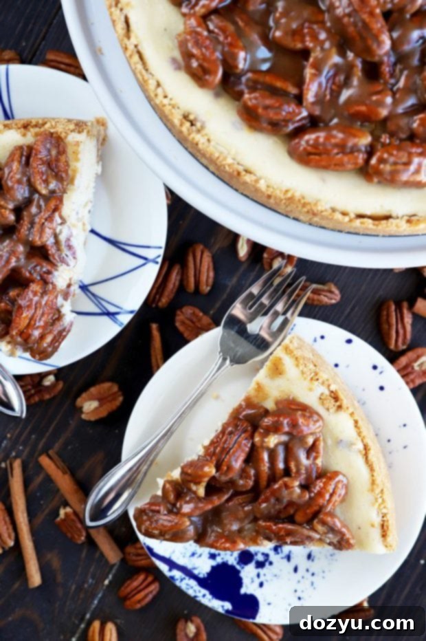 Slices of creamy pecan pie cheesecake, highlighting the smooth texture and pecan filling.