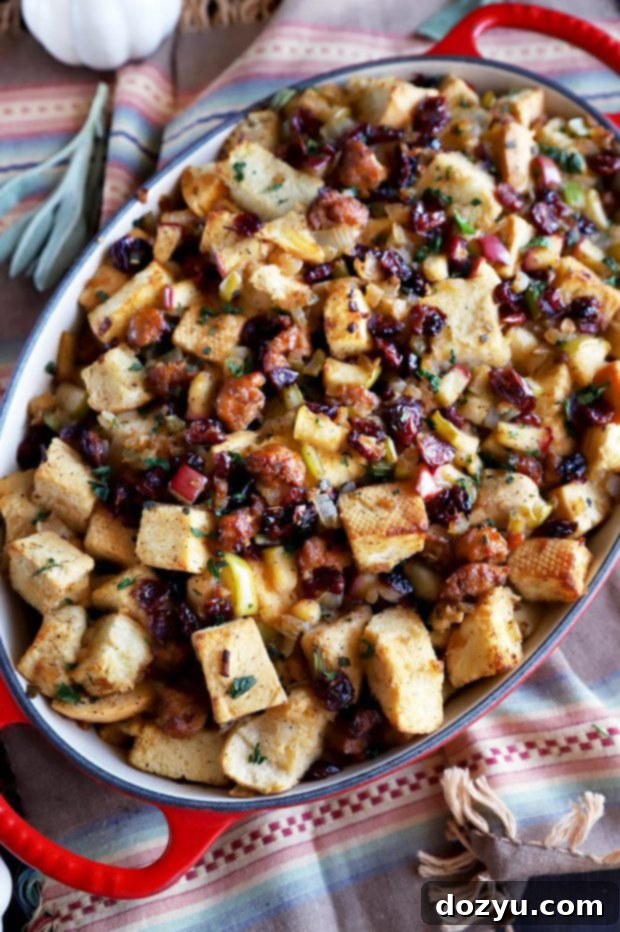 Harvest Apple, Caramelized Onion, and Sausage Stuffing 2 Photo of traditional stuffing in baking dish, richly golden brown
