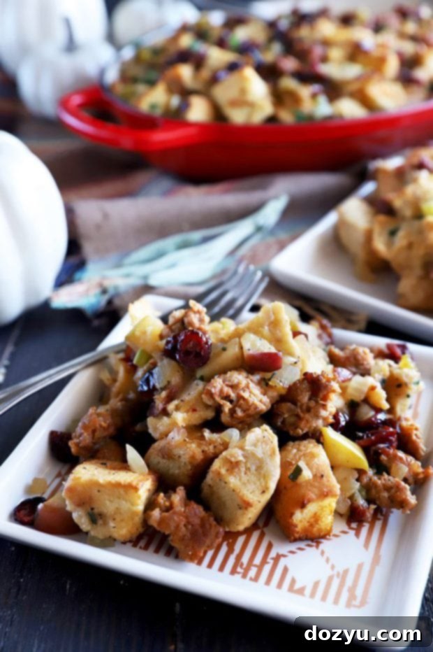 Harvest Apple, Caramelized Onion, and Sausage Stuffing 6 Plate of stuffing with visible apples, onions, and sausage pieces