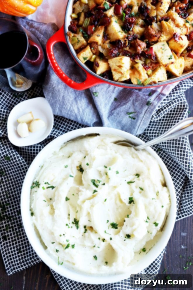 Close-up of creamy Instant Pot Mashed Potatoes with roasted garlic and Parmesan.