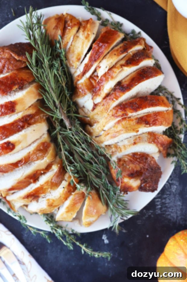 Photo of sliced turkey breast on platter, showcasing its moist texture.