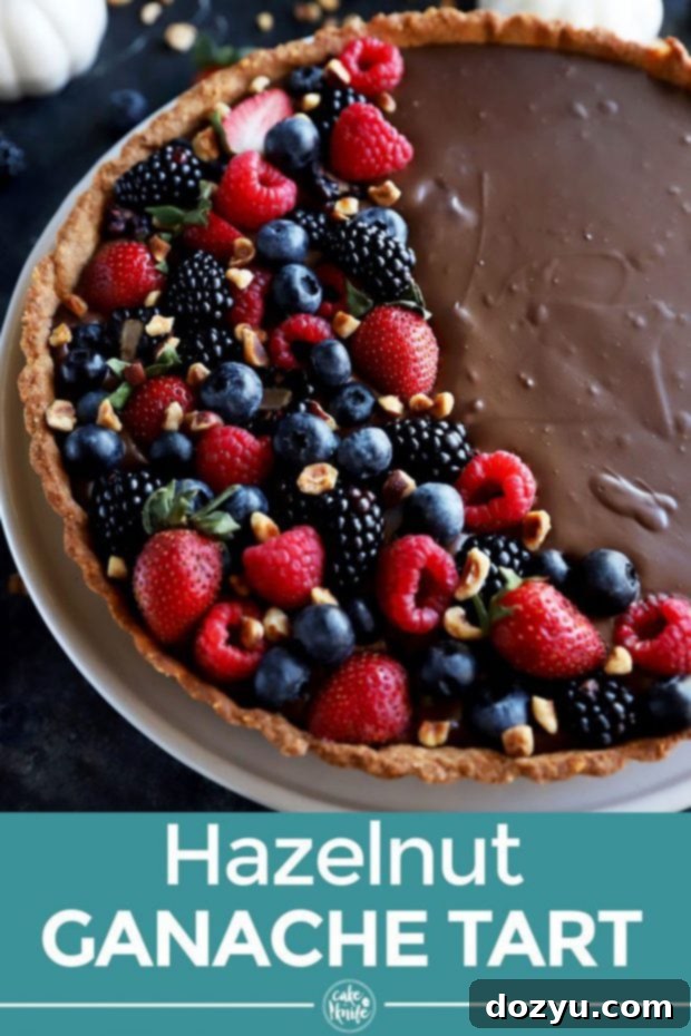 Pinterest optimized image for Chocolate Tart with Hazelnut Crust recipe, showcasing the tart with berries.