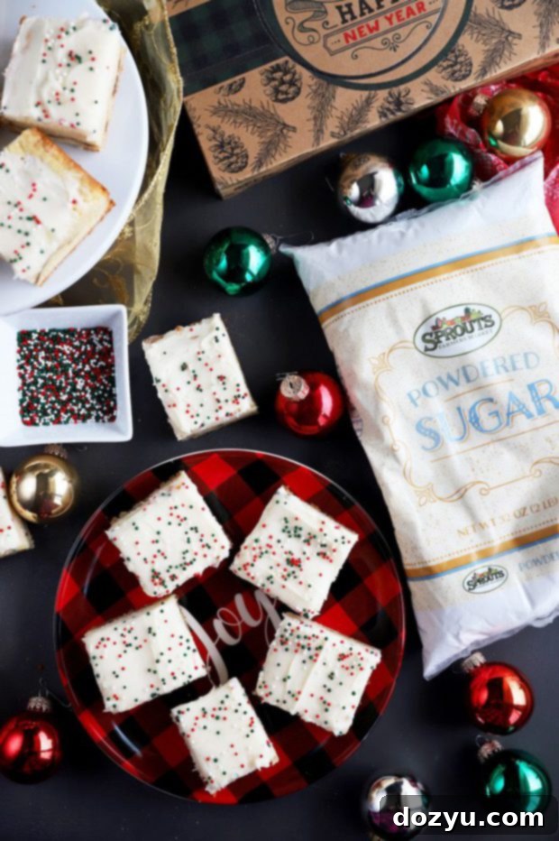 Close-up of a plate of snickerdoodle cookie bars with frosting, ready to be served