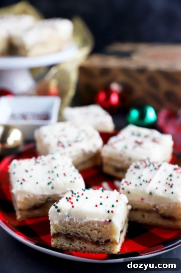 Process shot: Spreading half of the cookie dough into a baking pan