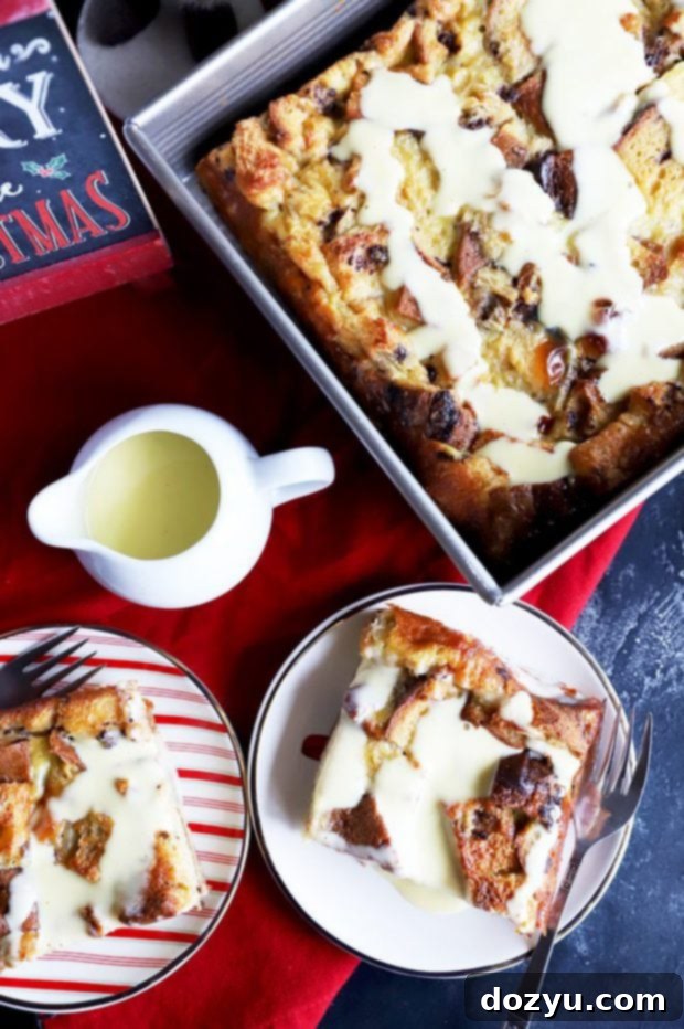 An overhead shot showcasing individual servings of Panettone Bread Pudding, elegantly plated and generously drizzled with crème anglaise, ready to be enjoyed.