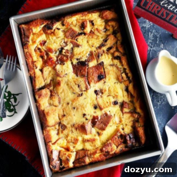 Thumbnail image of golden Panettone Bread Pudding with a creamy sauce drizzled over it.