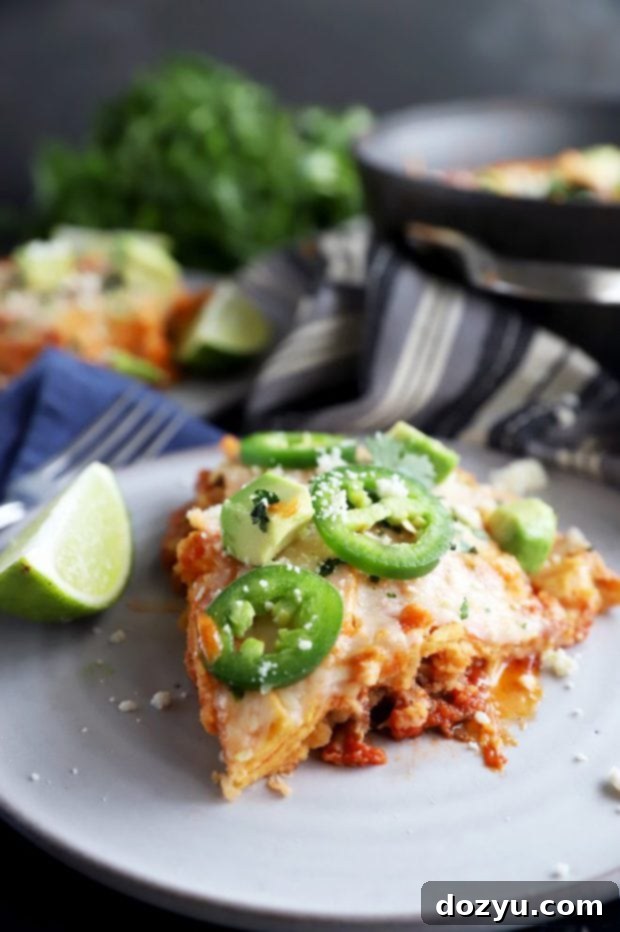 A perfectly sliced piece of Mexican short rib skillet pie showing layers