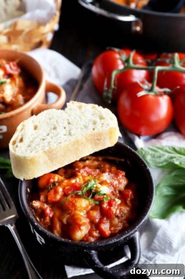 Gnocchi in a bowl with red meat sauce photo
