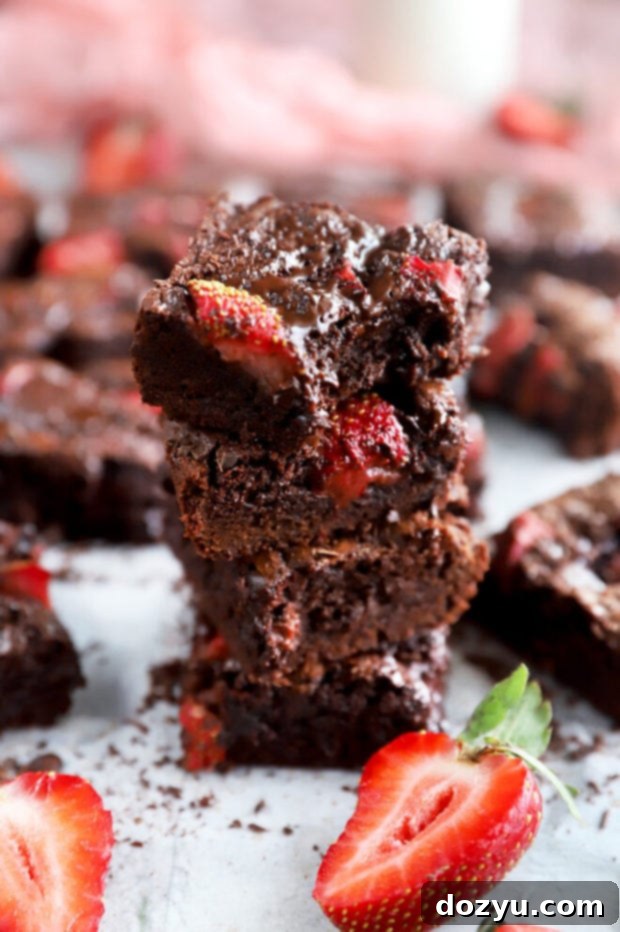 Velvet Berry Chocolate Brownies 7 Stacked up brownies pictures with strawberries visible