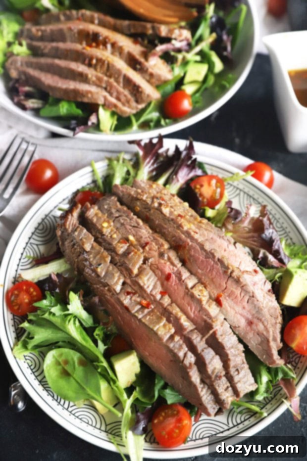 Umami Steak & Avocado Power Bowl 5 Prepared miso marinated steak salad in a serving bowl with fresh toppings