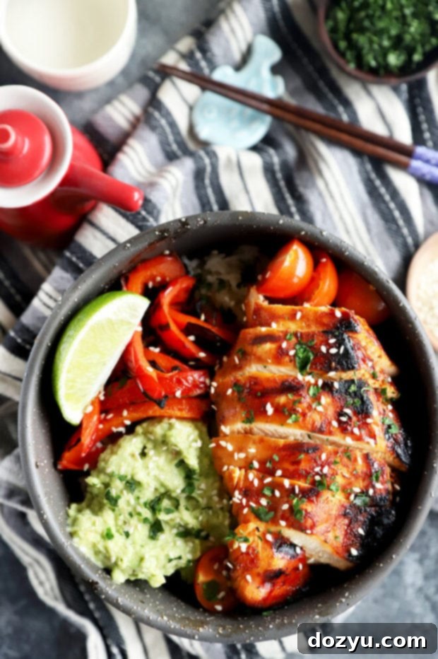 Vibrant Korean chicken and rice bowl, perfectly portioned for two