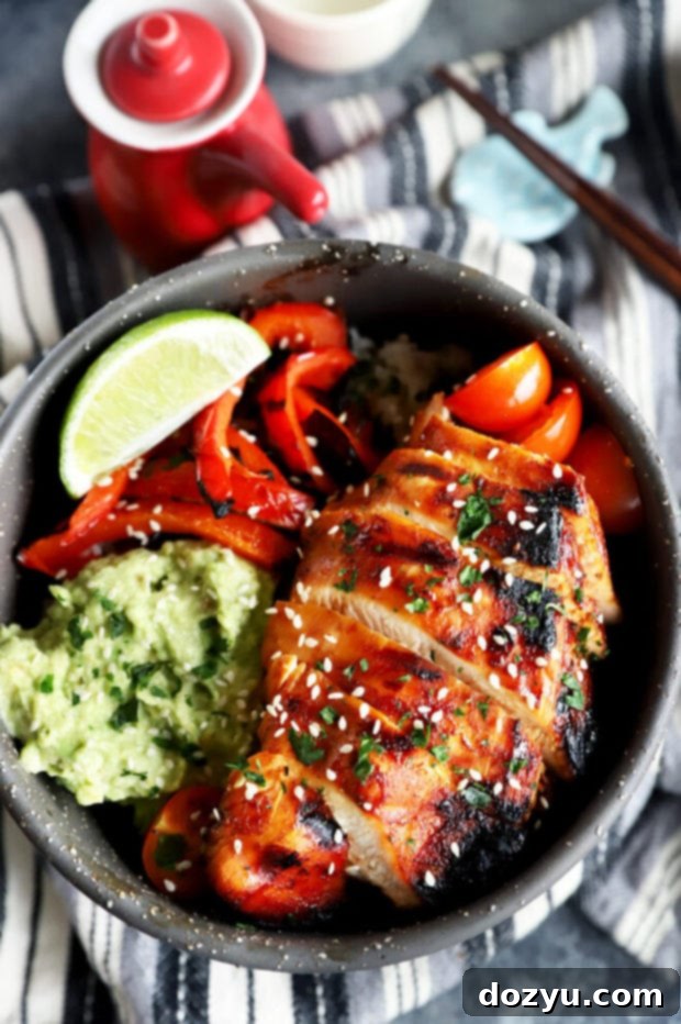 Perfectly sliced Korean spicy chicken ready to be served in a rice bowl