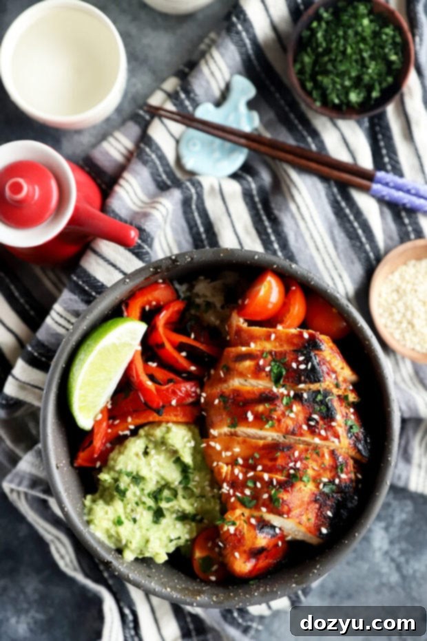 Overhead shot of two beautifully arranged Korean chicken rice bowls