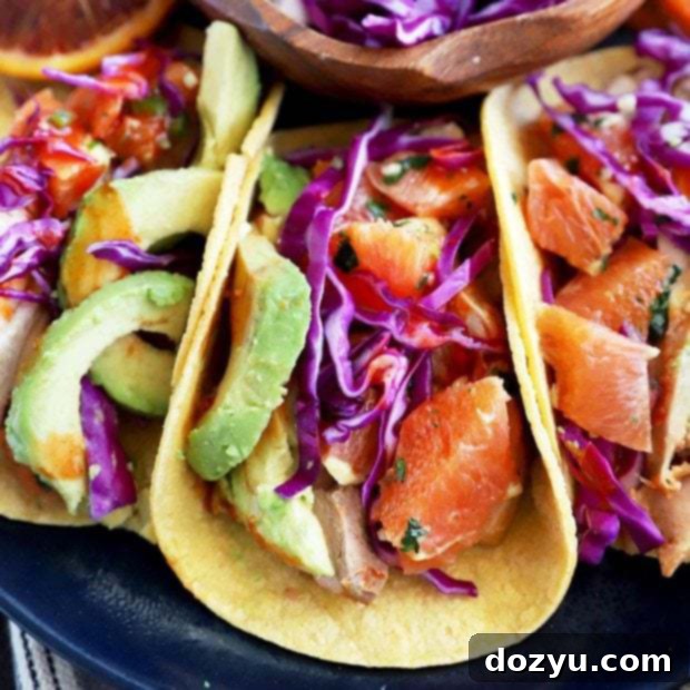 A circular thumbnail image of a Blood Orange Honey Ginger Chicken Taco, displaying its colorful ingredients and inviting presentation.