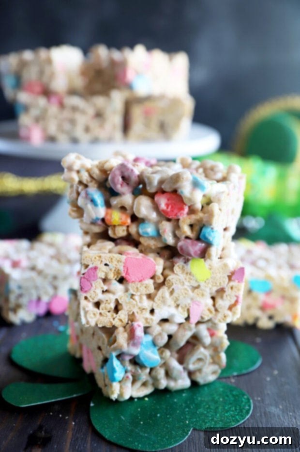 Vibrant Lucky Charms cereal treats stacked with colorful marshmallows, perfect for St. Patrick's Day celebrations.