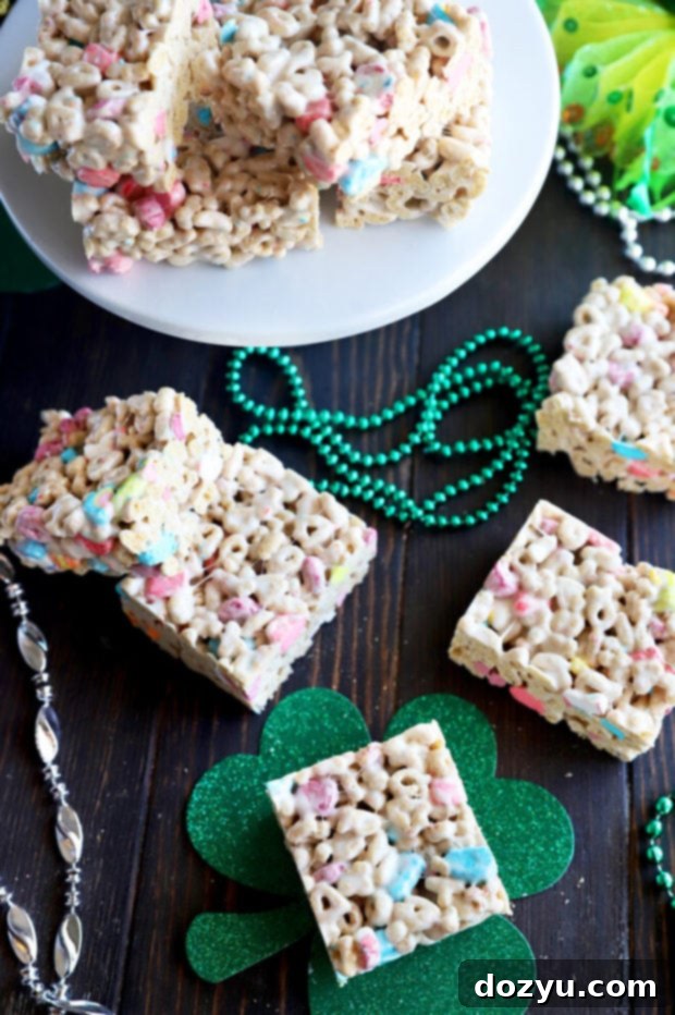 Overhead shot of a batch of homemade Lucky Charms cereal treats, cut into perfect squares and ready for serving.