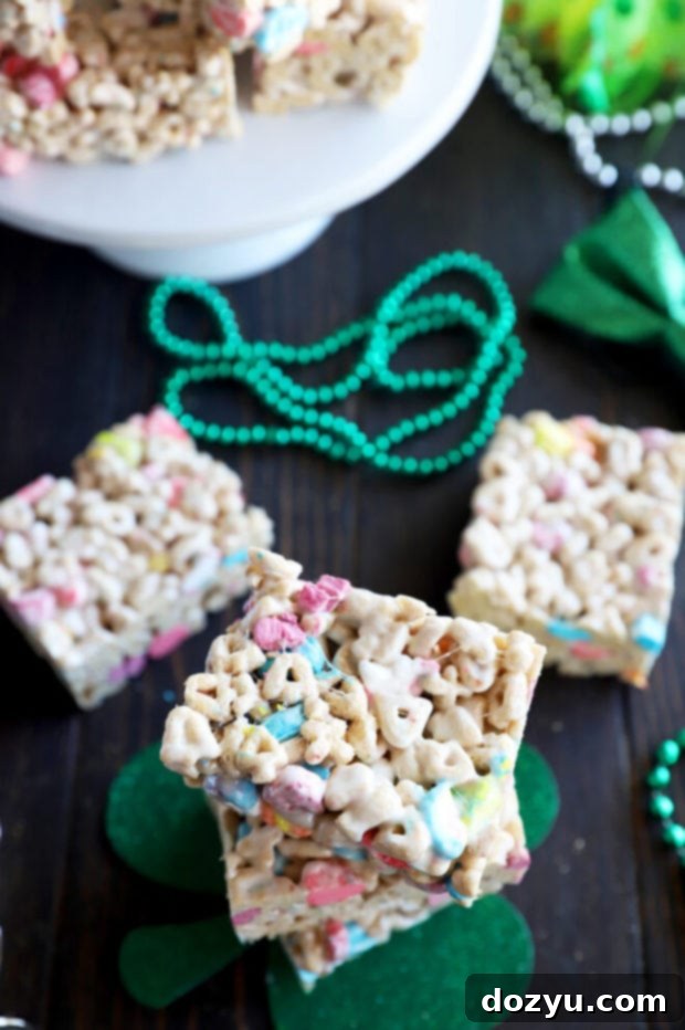 A festive arrangement of Lucky Charms cereal treats on a white platter, ready for a St. Patrick's Day party.