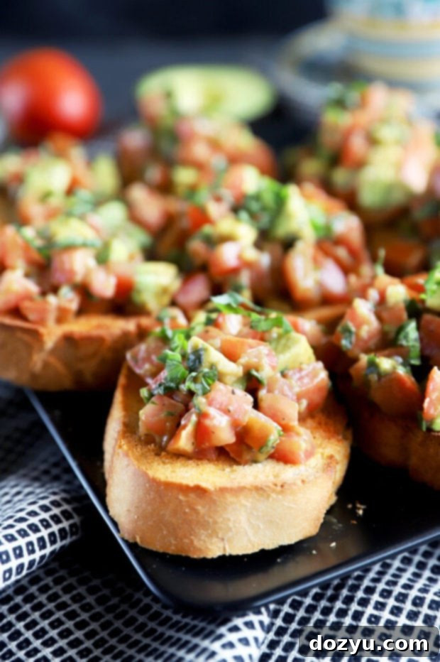 Side photo of avocado bruschetta on toasted bread