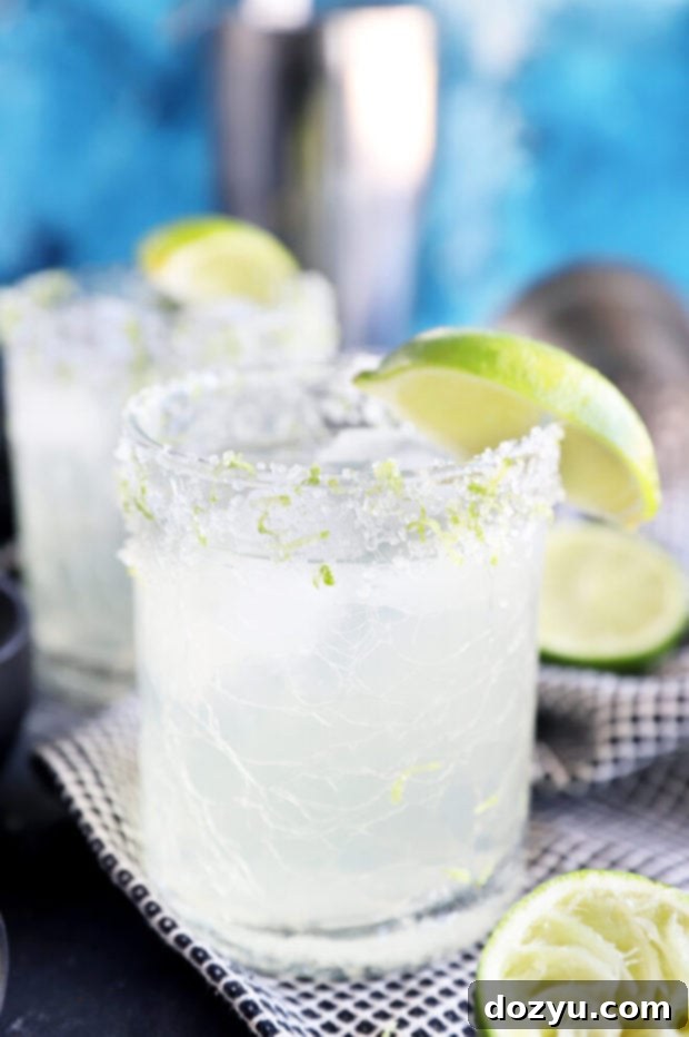 glasses of limeade margaritas with lime wedges