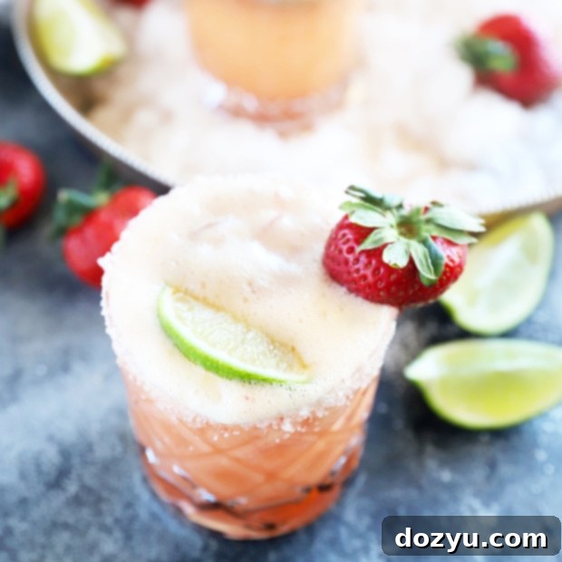Thumbnail image of a delicious Strawberry Margarita Mimosa, garnished with fresh fruit, ready to be prepared